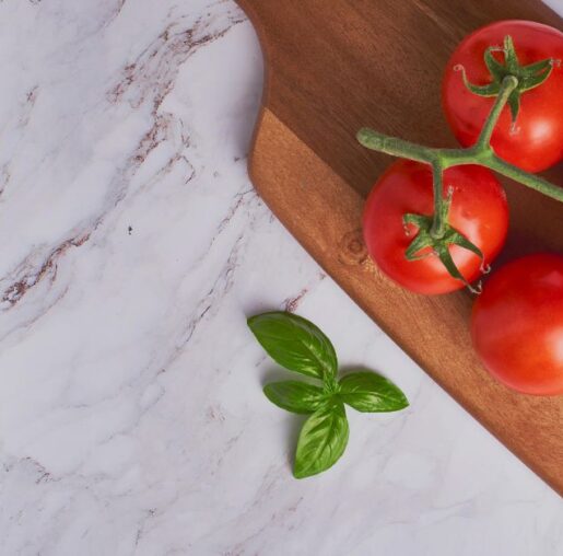 Granite countertop with cutting board.